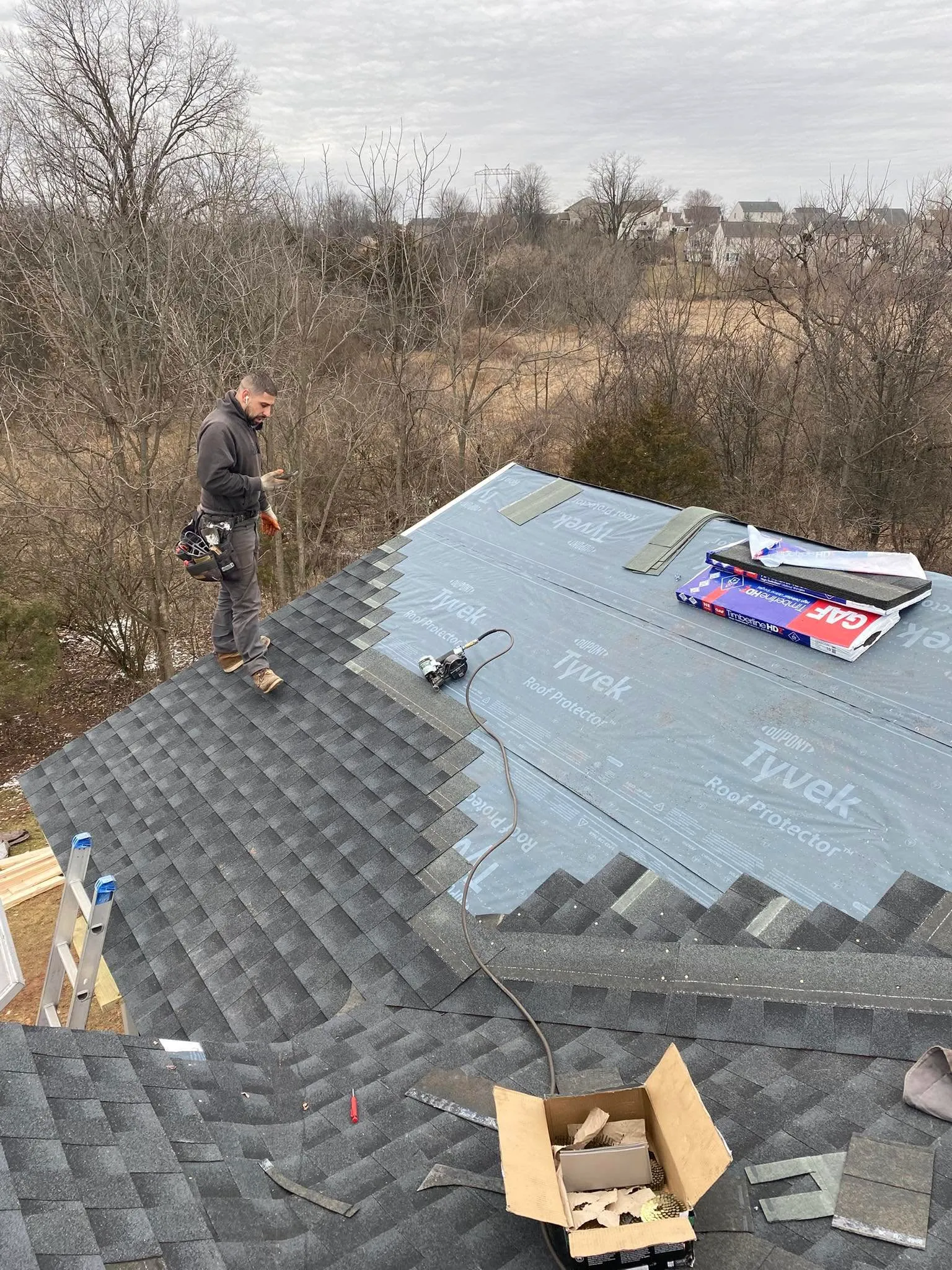 Legacy Roofing crew installing shingles in Lancaster County, PA